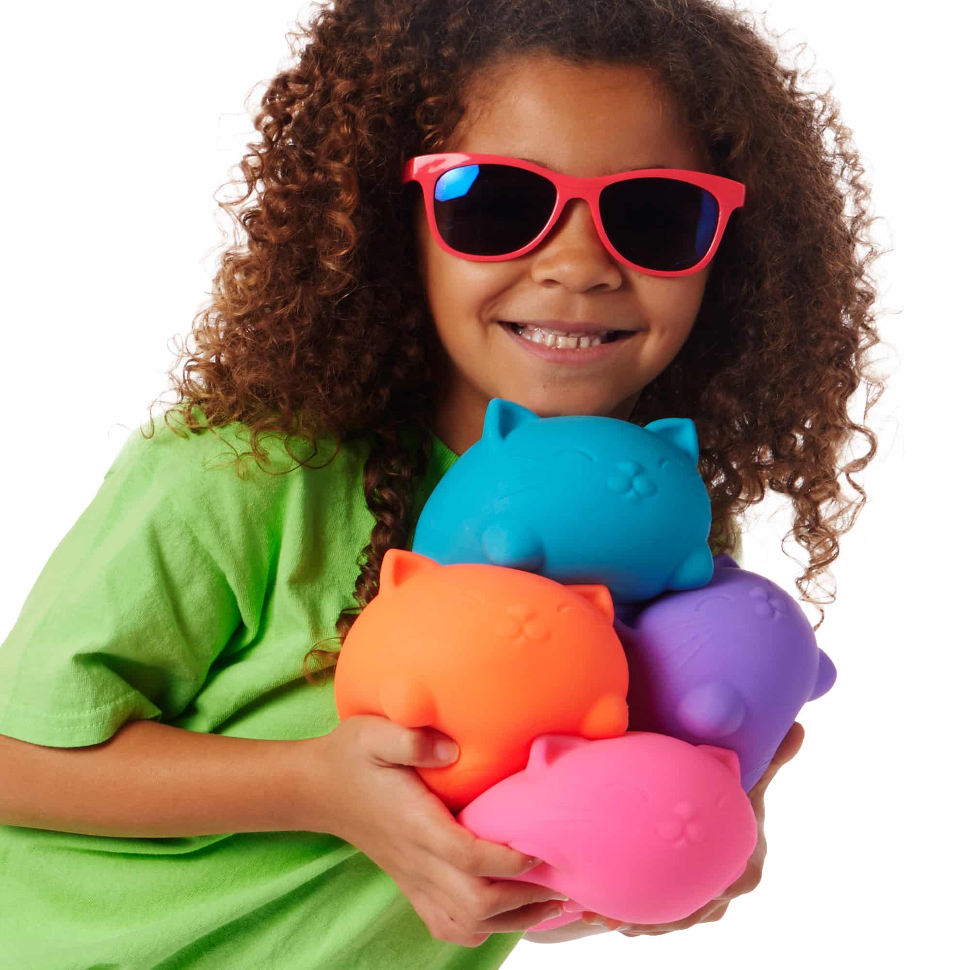 NeeDoh Super Cool Cats A4 - Lifestyle with girl holding all four colors Super Cool Cats A4
