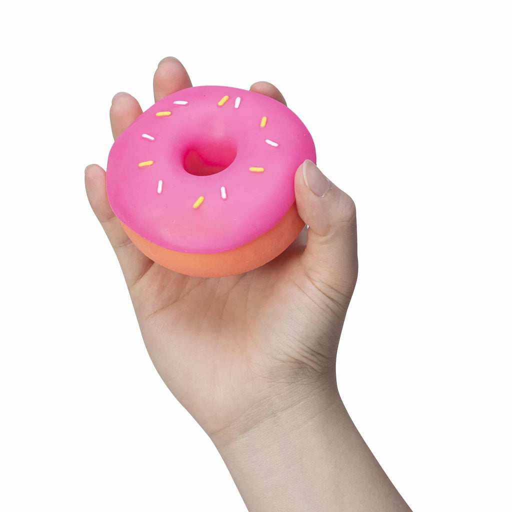 NeeDoh Dohnuts K9 Orange with Prink Frosting and Sprinkles in Hand