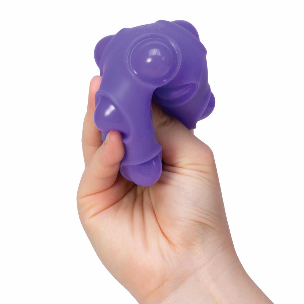 NeeDoh Happy Snappy I8 - Hand squeezing purple Happy Snappy I8