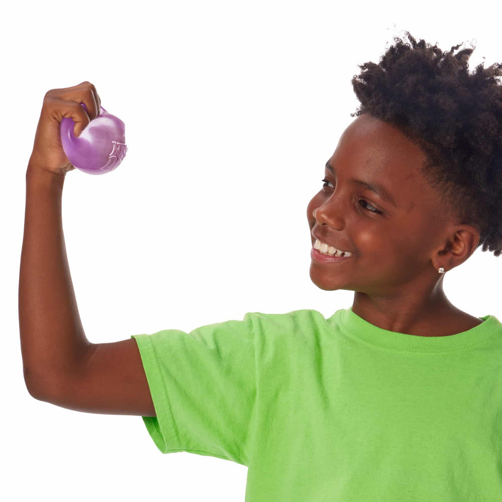 NeeDoh Nice Cube P2 Lifestyle of boy squeezing purple Nice Cube P2