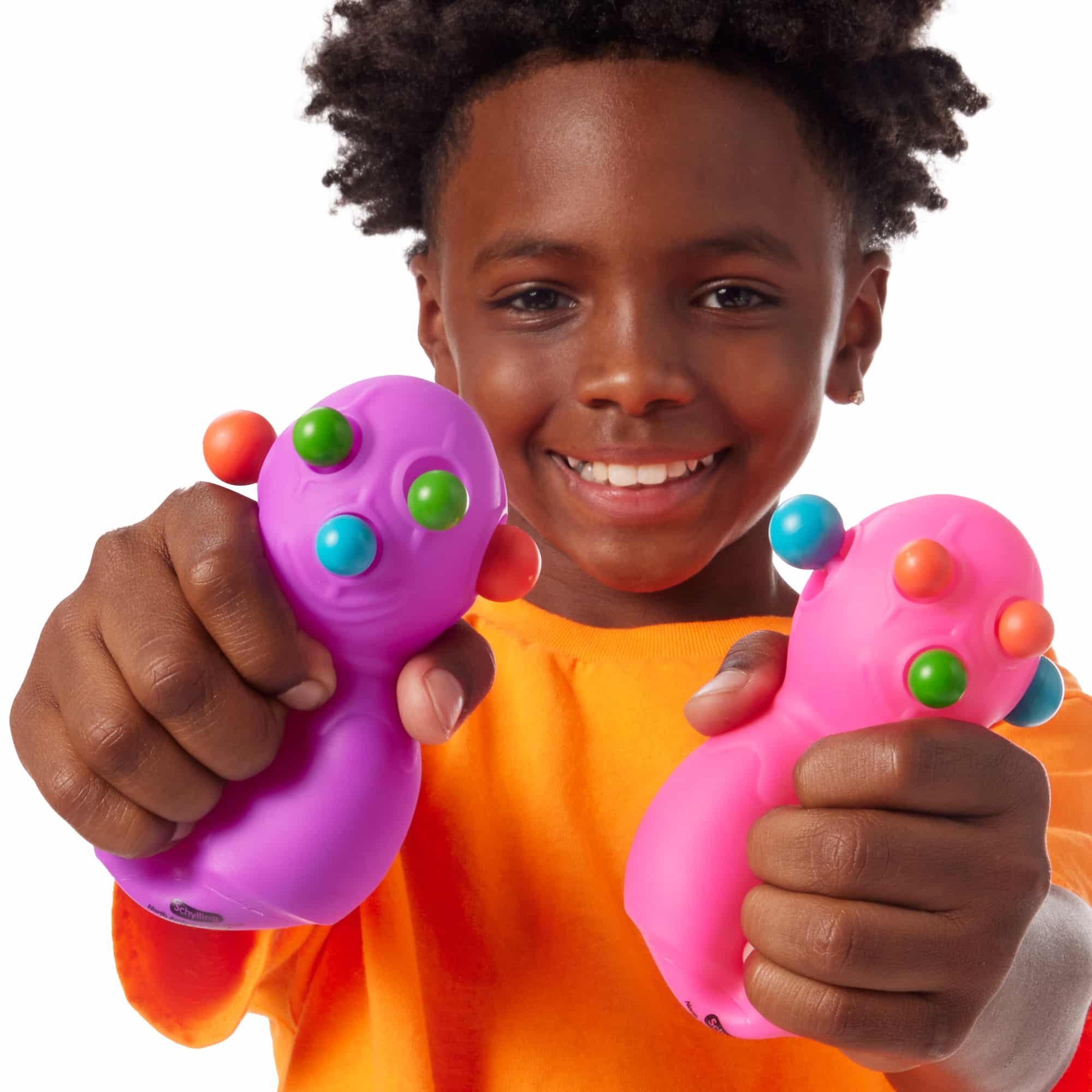 NeeDoh Panic Pete R4 Lifestyle with boy squeezing purple and pink Panic Pete R4s