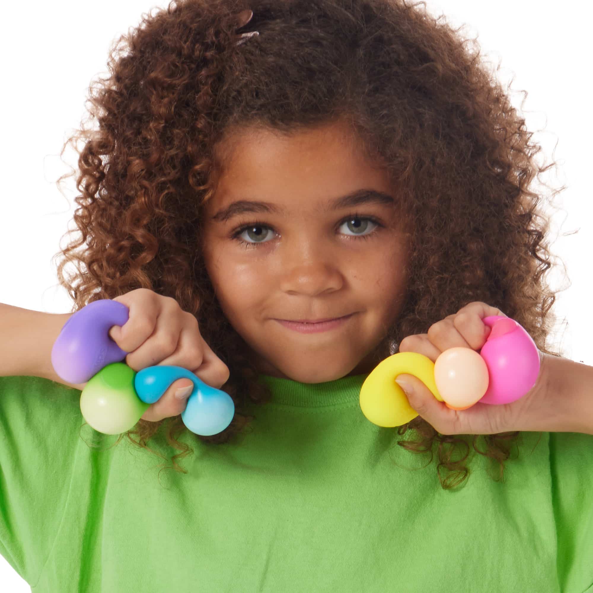 Girl squeezing 6 Rainboh W9 Teenie NeeDoh